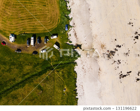 Aerial view. Sandy beach with parking area 131196622