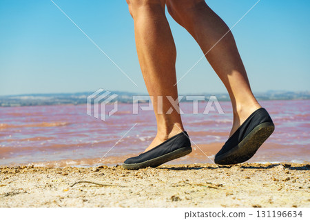 Woman on pink lake in Spain 131196634