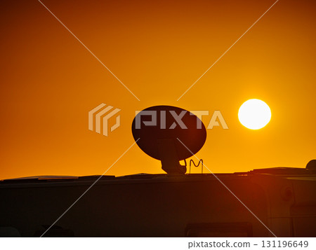 Satellite dish on roof of caravan 131196649