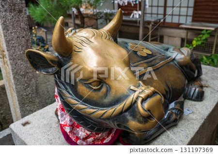 Cow statue at Tenmangu Shrine in Kyoto Cow statue at Tenmangu Shrine in Kyoto 131197369
