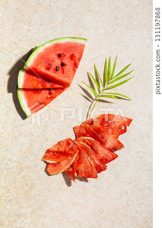Winter supplies: slices of dried watermelon with fresh pieces on light background Winter supplies: slices of dried watermelon with fresh pieces on light background 131197868