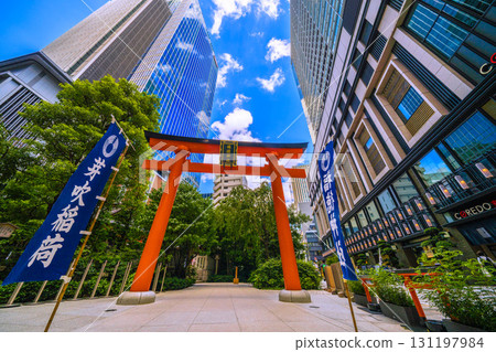 Tokyo cityscape in Japan, with views of Fukutoku Shrine in the valley between buildings in Nihonbashi Muromachi. Today, September 24th, is Ichirimanbai Day. Tokyo cityscape in Japan, with views of Fukutoku Shrine in the valley between buildings in Nihonbashi Muromachi. Today, September 24th, is Ichirimanbai Day. 131197984