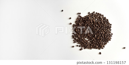 Coffee beans scattered on a white background, top view. Minimal banner template with empty space for text. Coffee background for advertising, cafe, restaurant, social media Coffee beans scattered on a white background, top view. Minimal banner template with empty space for text. Coffee background for advertising, cafe, restaurant, social media 131198157