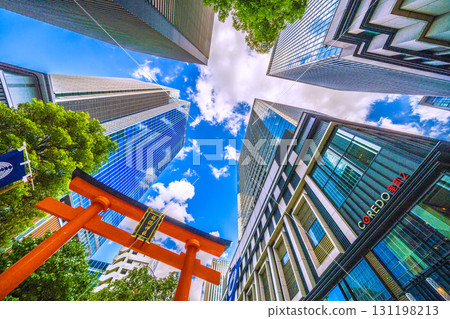 Tokyo cityscape in Japan, with views of Fukutoku Shrine in the valley between buildings in Nihonbashi Muromachi. Today, September 24th, is Ichirimanbai Day. Tokyo cityscape in Japan, with views of Fukutoku Shrine in the valley between buildings in Nihonbashi Muromachi. Today, September 24th, is Ichirimanbai Day. 131198213
