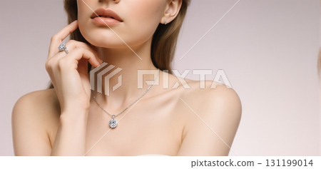 Elegant jewelry close-up showcasing diamond necklaces and rings in luxury fashion style 131199014