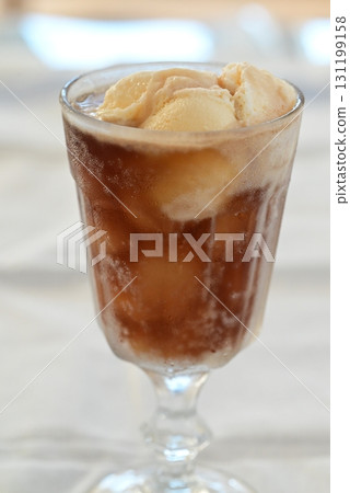 A sweet, cold and deliciously refreshing cola float A sweet, cold and deliciously refreshing cola float 131199158