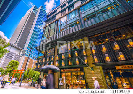 Tokyo cityscape in Japan, with views of Fukutoku Shrine in the valley between buildings in Nihonbashi Muromachi. Today, September 24th, is Ichirimanbai Day. Tokyo cityscape in Japan, with views of Fukutoku Shrine in the valley between buildings in Nihonbashi Muromachi. Today, September 24th, is Ichirimanbai Day. 131199289
