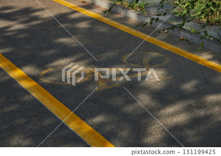 Bike lane, bicycle path with yellow markings. Bike lane, bicycle path with yellow markings. 131199425