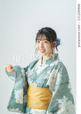 Teenage girl wearing a yukata 131200666