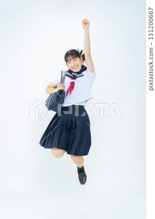 Full-body photo of a female student in a sailor suit jumping energetically Full-body photo of a female student in a sailor suit jumping energetically 131200667