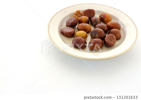 Peeled sweet chestnuts on white background Peeled sweet chestnuts on white background 131201633