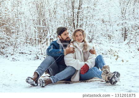 Happy young couple in the winter forest feeling excited and enjoyed Happy young couple in the winter forest feeling excited and enjoyed 131201875