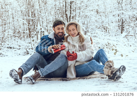 Happy young couple in the winter forest feeling excited and enjoyed Happy young couple in the winter forest feeling excited and enjoyed 131201876