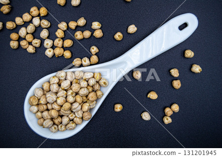 Beautiful organic dried chickpea beans consisting of raw bengal legume pea 131201945
