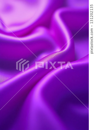 Smooth and rich in color, the purple silk flows effortlessly, creating ripples that reflect light. Its texture offers a luxurious feel, inspiring thoughts of refinement and artistry Generative AI 131202135