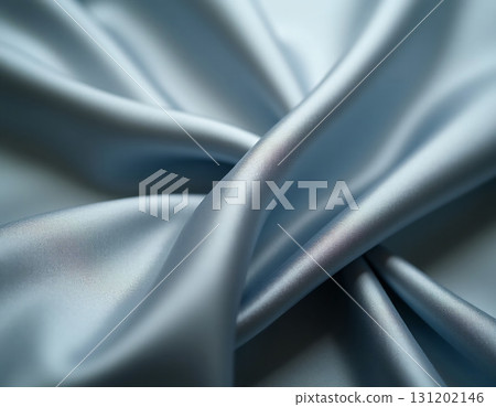 Soft blue silk cascades gracefully, creating delicate curves and smooth lines. The fabric catches ambient light, revealing a luxurious sheen and inviting touch, perfect for design Generative AI 131202146