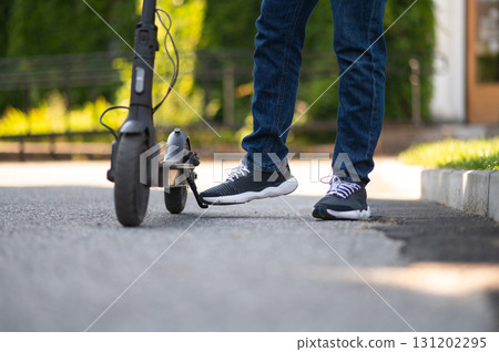 Close up of a boys legs and the scooter Close up of a boys legs and the scooter 131202295