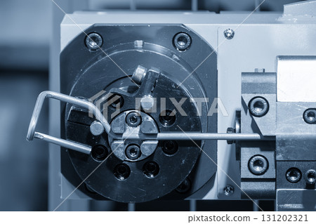 The steel wire forming machine in the light blue scene. 131202321