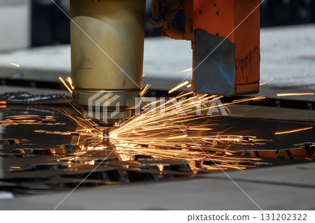 Close up scene the fiber laser cutting machine cut the metal plate control by CNC program. 131202322