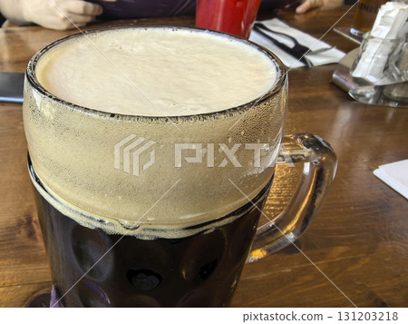 Enjoying a refreshing beverage in a cozy restaurant setting Enjoying a refreshing beverage in a cozy restaurant setting 131203218