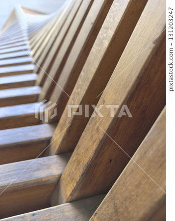 Beautiful wooden slats create a stunning architectural feature in natural light Beautiful wooden slats create a stunning architectural feature in natural light 131203247