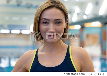 Confident pretty caucasian young woman at the pool Confident pretty caucasian young woman at the pool 131203331