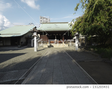 Light shining onto the shrine's approach under a refreshing blue sky 131203431