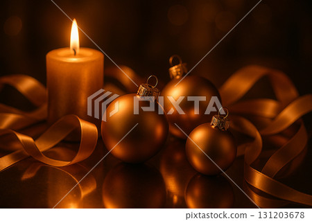 Golden baubles and ornaments with glowing candle on dark festive background. Golden baubles and ornaments with glowing candle on dark festive background. 131203678