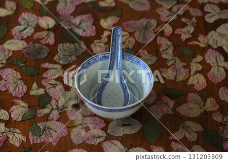 Empty white ceramic bowls on wooden background 131203809