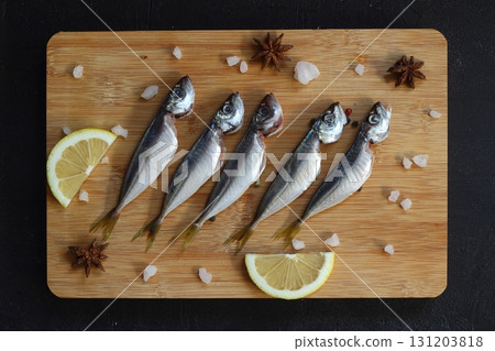 Fresh fish horse mackerel on a dark background 131203818