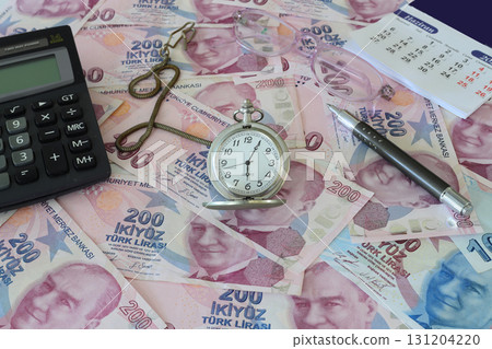Turkish lira and old clock. Selective Focus. Turkish lira and old clock. Selective Focus. 131204220