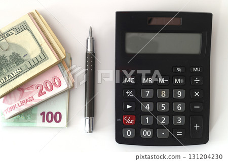 dollar, eruo and turkish lira with a Calculator and a Pen dollar, eruo and turkish lira with a Calculator and a Pen 131204230