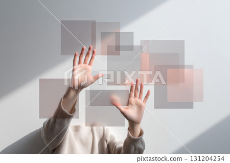 Hands reaching towards floating transparent squares modern minimal style soft natural light creative technology concept abstract composition Asian person innovation curiosity 131204254