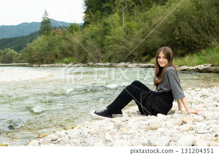 Modern Stylish Teenage Girl Outdoors Near the River. Modern Stylish Teenage Girl Outdoors Near the River. 131204351