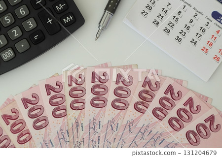 Turksh Lira banknotes of various color, pattern and value on white background. 131204679