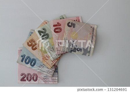 Turksh Lira banknotes of various color, pattern and value on white background Turksh Lira banknotes of various color, pattern and value on white background 131204691