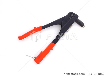 A riveter for crimping aluminum rivets. Tools for assembly in a machine shop. Light background 131204862