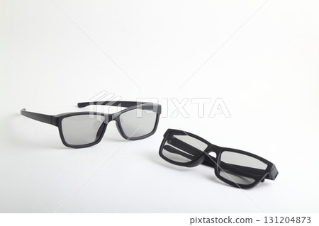 Two pairs of 3d glasses for cinema. Watching movie in 3d. Black glasses on white background 131204873