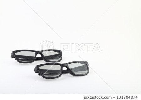 Two pairs of 3d glasses for cinema. Watching movie in 3d. Black glasses on white background 131204874