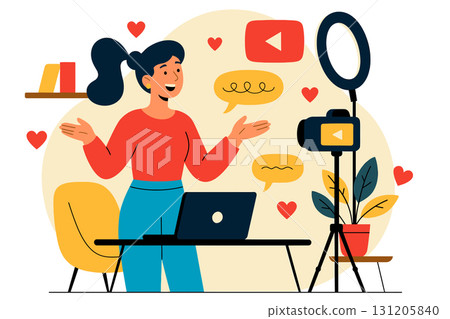 Young woman sits at table and records video for YouTube with camera on tripod, smiling and speaking to the audience. Young woman sits at table and records video for YouTube with camera on tripod, smiling and speaking to the audience. 131205840