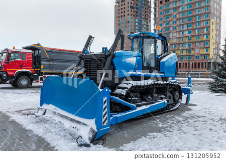 Blue bulldozer tractor with mouldboard at winter day 131205952