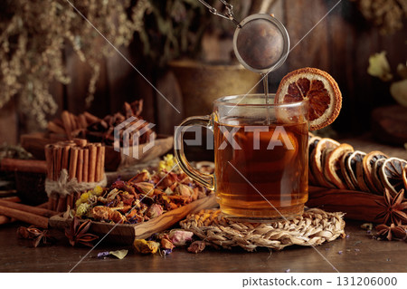 Cup of herbal tea with various dried herbs, flowers, and spices. Cup of herbal tea with various dried herbs, flowers, and spices. 131206000