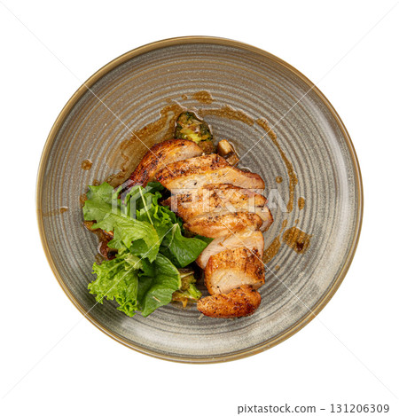 Isolated chicken breast with vegetables and sauce Isolated chicken breast with vegetables and sauce 131206309