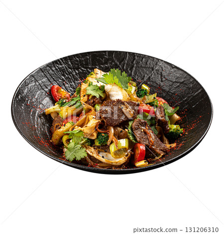 Isolated wok noodles with beef and vegetables 131206310