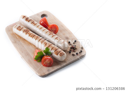 Grilled white sausages with cherry tomatoes and parsley Grilled white sausages with cherry tomatoes and parsley 131206386