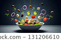 Fresh vegetables, olives, and feta cheese elements hover artistically above a Greek salad. Olive oil drizzles down, enhancing the vibrant colors and textures of the dish. 131206610