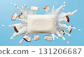 A coconut bar of soap is at the center, surrounded by white coconut pieces and foaming bubbles. This vibrant setup highlights a refreshing and clean aesthetic perfect for skincare. 131206687
