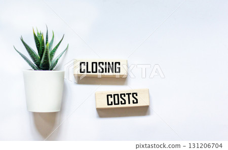 CLOSING COSTS - words on wooden blocks on a white background CLOSING COSTS - words on wooden blocks on a white background 131206704