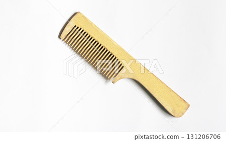 A wooden comb isolated on white background A wooden comb isolated on white background 131206706