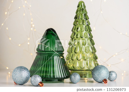 Green Glass Christmas Trees with Ornaments and Fairy Lights Green Glass Christmas Trees with Ornaments and Fairy Lights 131206973